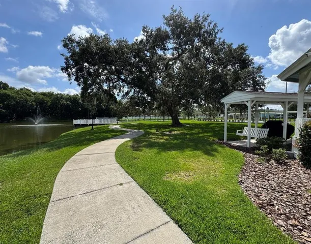 a view of a lake with a yard