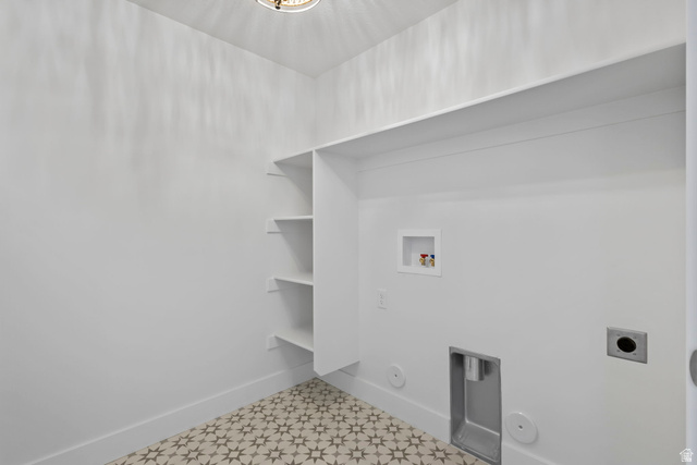 728 East Mountain Road North Ogden, UT 84414 - Photo 21 of 28 Laundry space featuring patterned floor tiles, built-in shelving, an overhead light fixture, and white baseboards