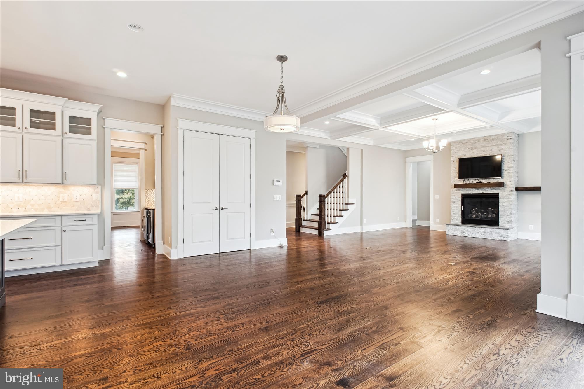 1565 Hane Street McLean, VA 22101 - Photo 11 of 43 a view of a livingroom with wooden floor and a kitchen
