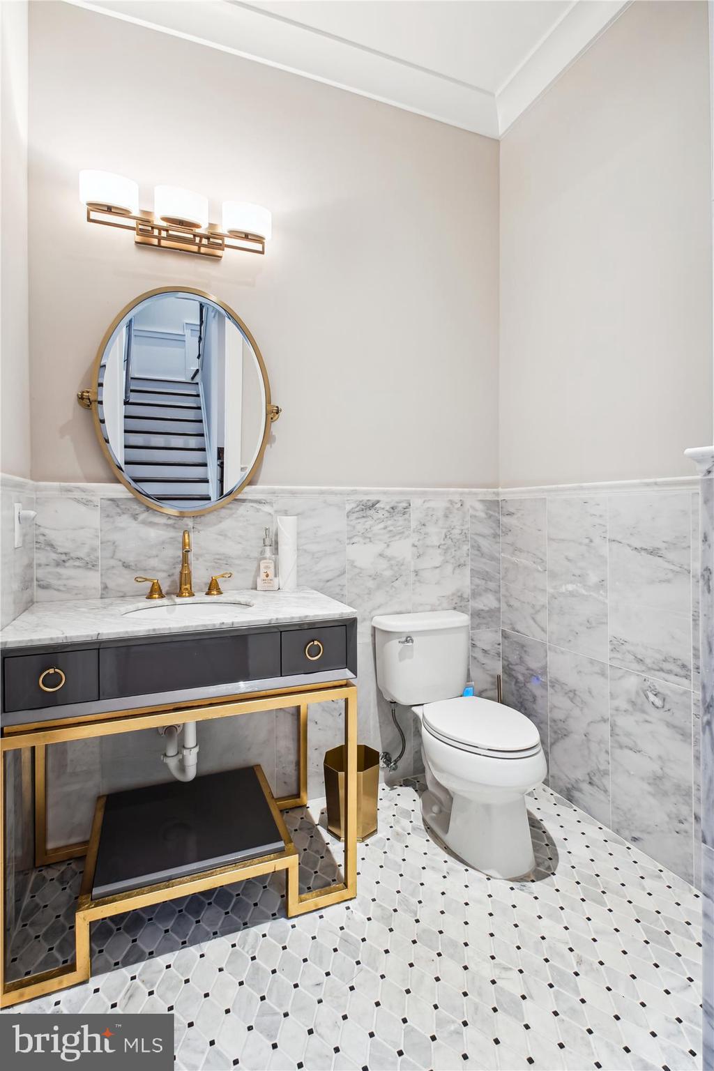 1565 Hane Street McLean, VA 22101 - Photo 12 of 43 a bathroom with a sink a toilet and a mirror