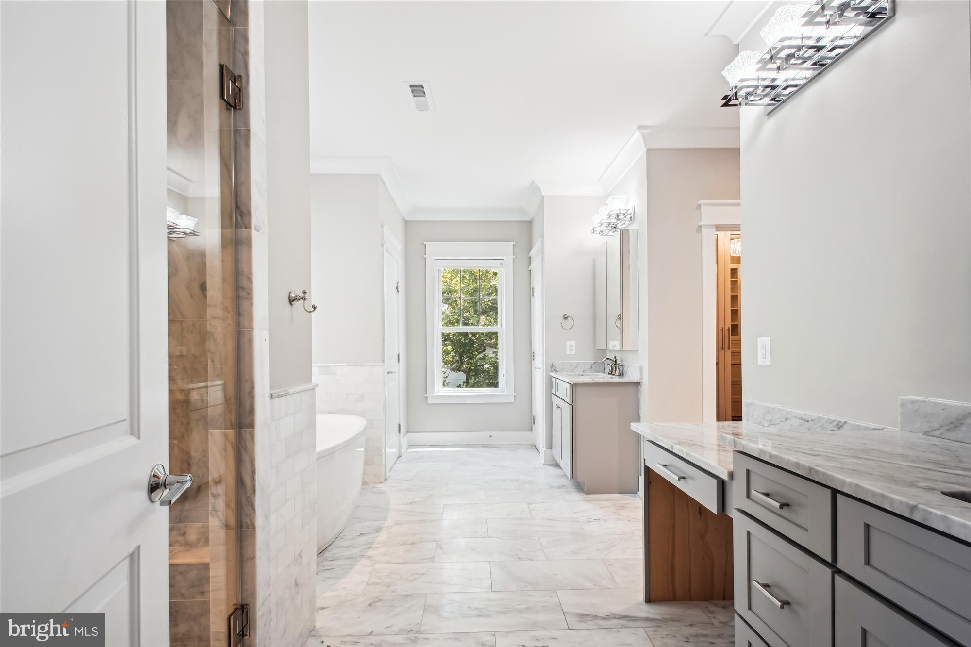 1565 Hane Street McLean, VA 22101 - Photo 16 of 43 a large bathroom with a granite countertop tub sink and mirror