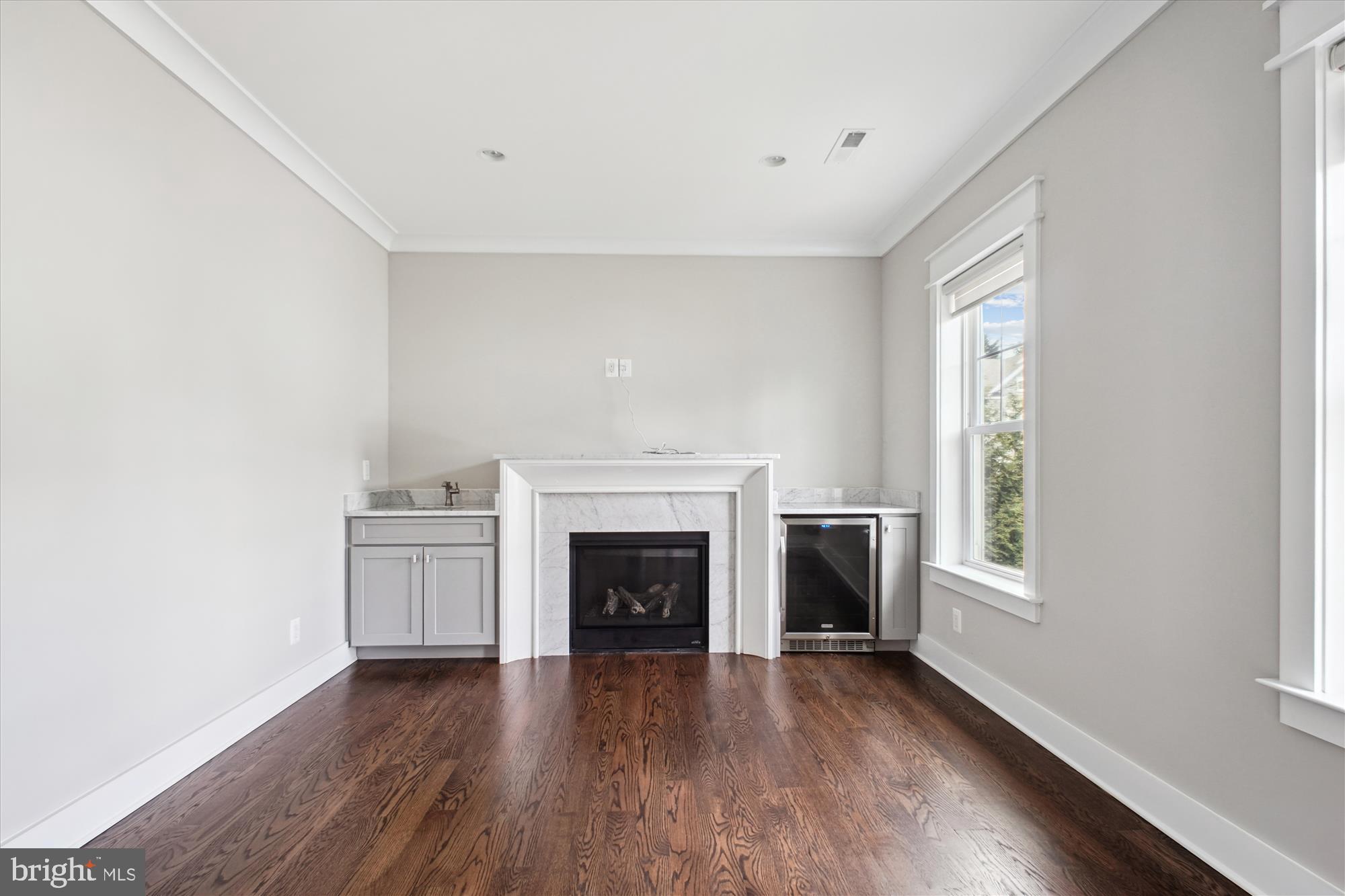 1565 Hane Street McLean, VA 22101 - Photo 17 of 43 a view of an empty room with a fireplace and a window