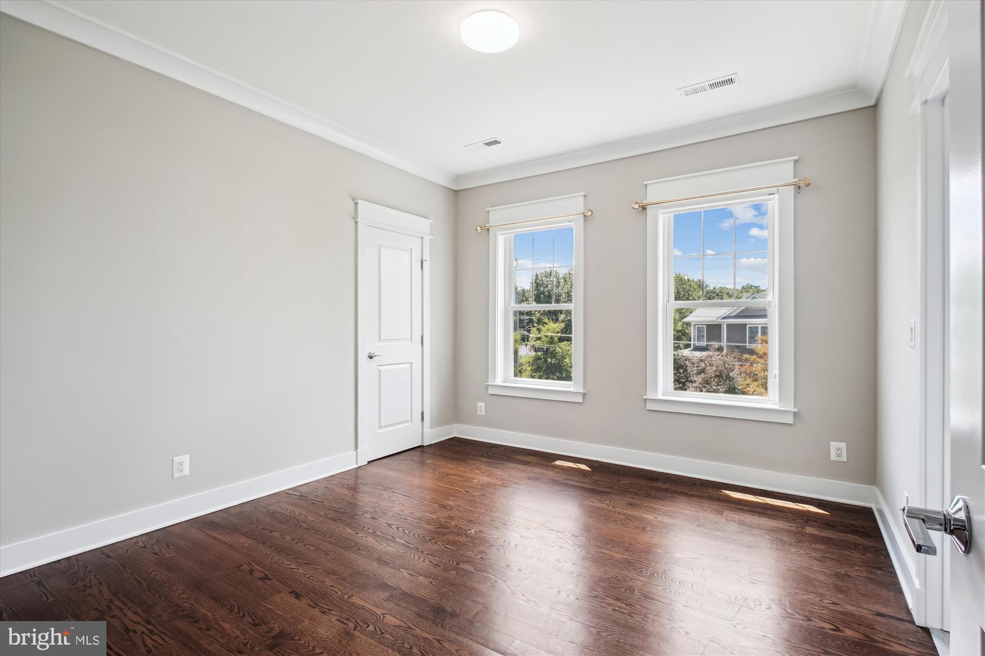 1565 Hane Street McLean, VA 22101 - Photo 23 of 43 an empty room with wooden floor and windows