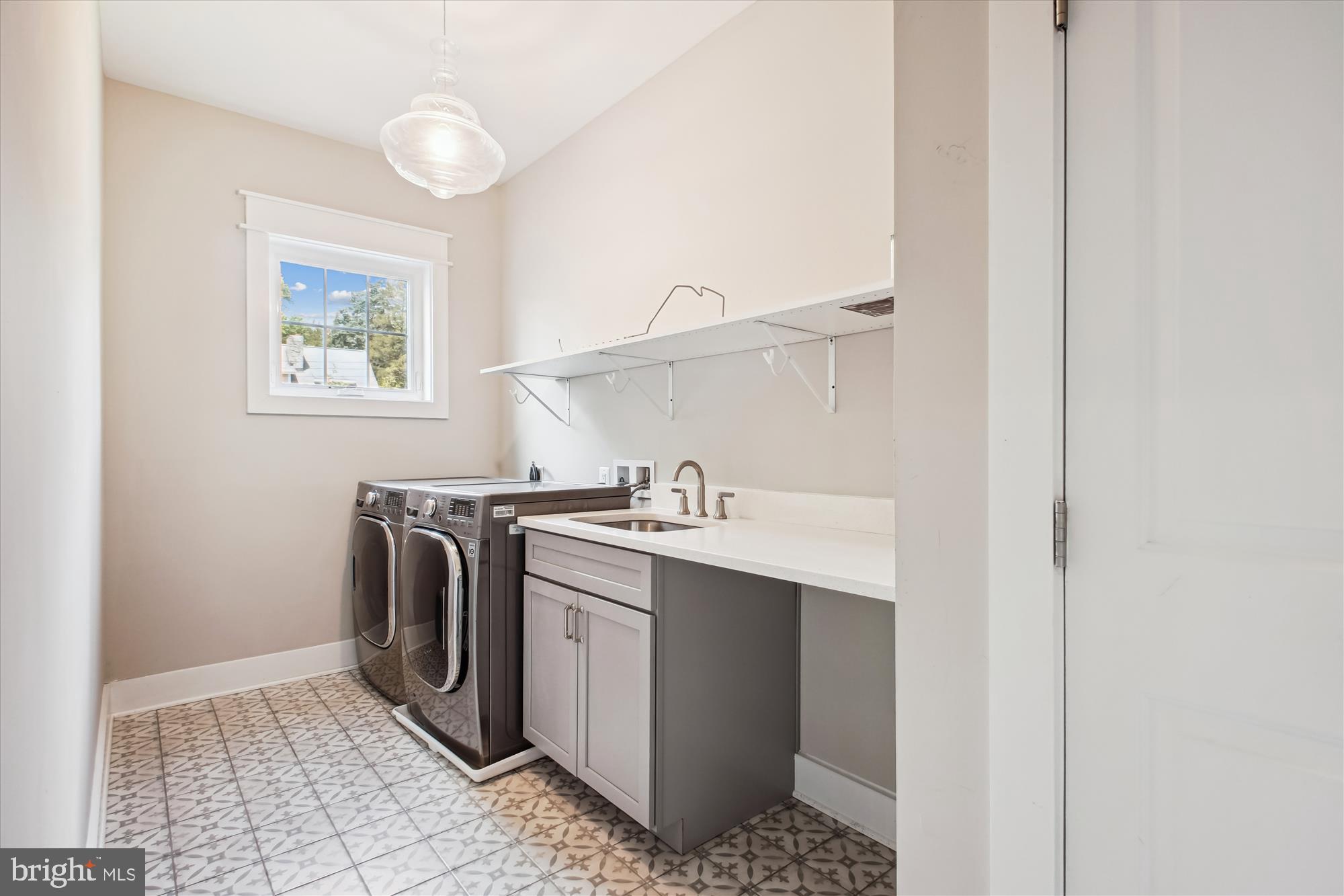 1565 Hane Street McLean, VA 22101 - Photo 26 of 43 a utility room with a sink a washer and dryer
