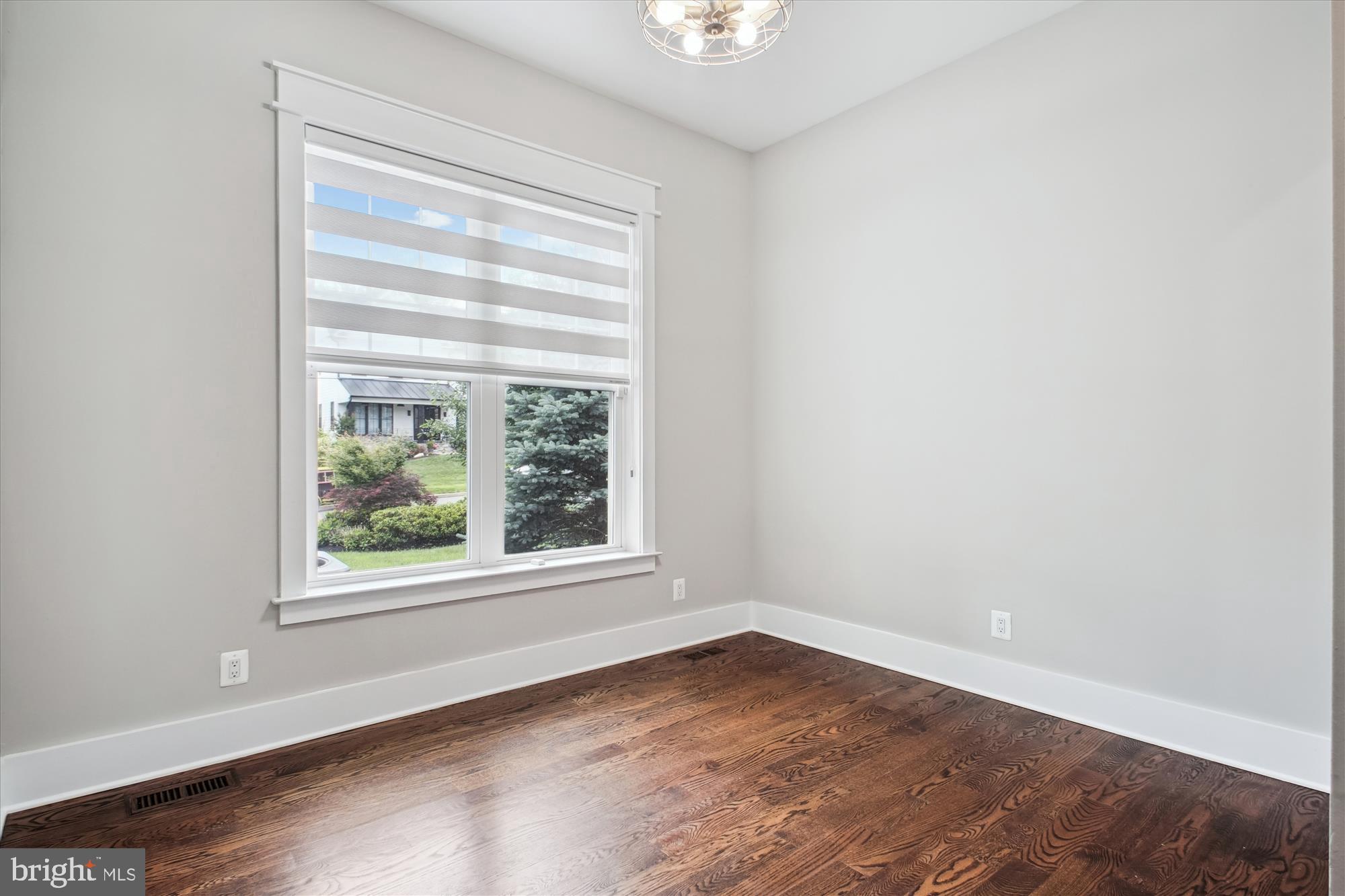 1565 Hane Street McLean, VA 22101 - Photo 27 of 43 an empty room with wooden floor and windows