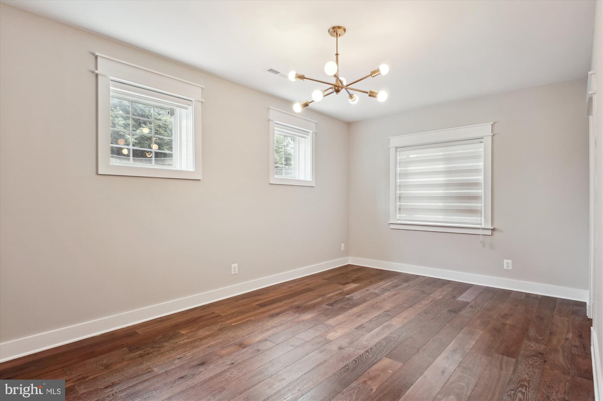1565 Hane Street McLean, VA 22101 - Photo 31 of 43 a view of an empty room with wooden floor and a window