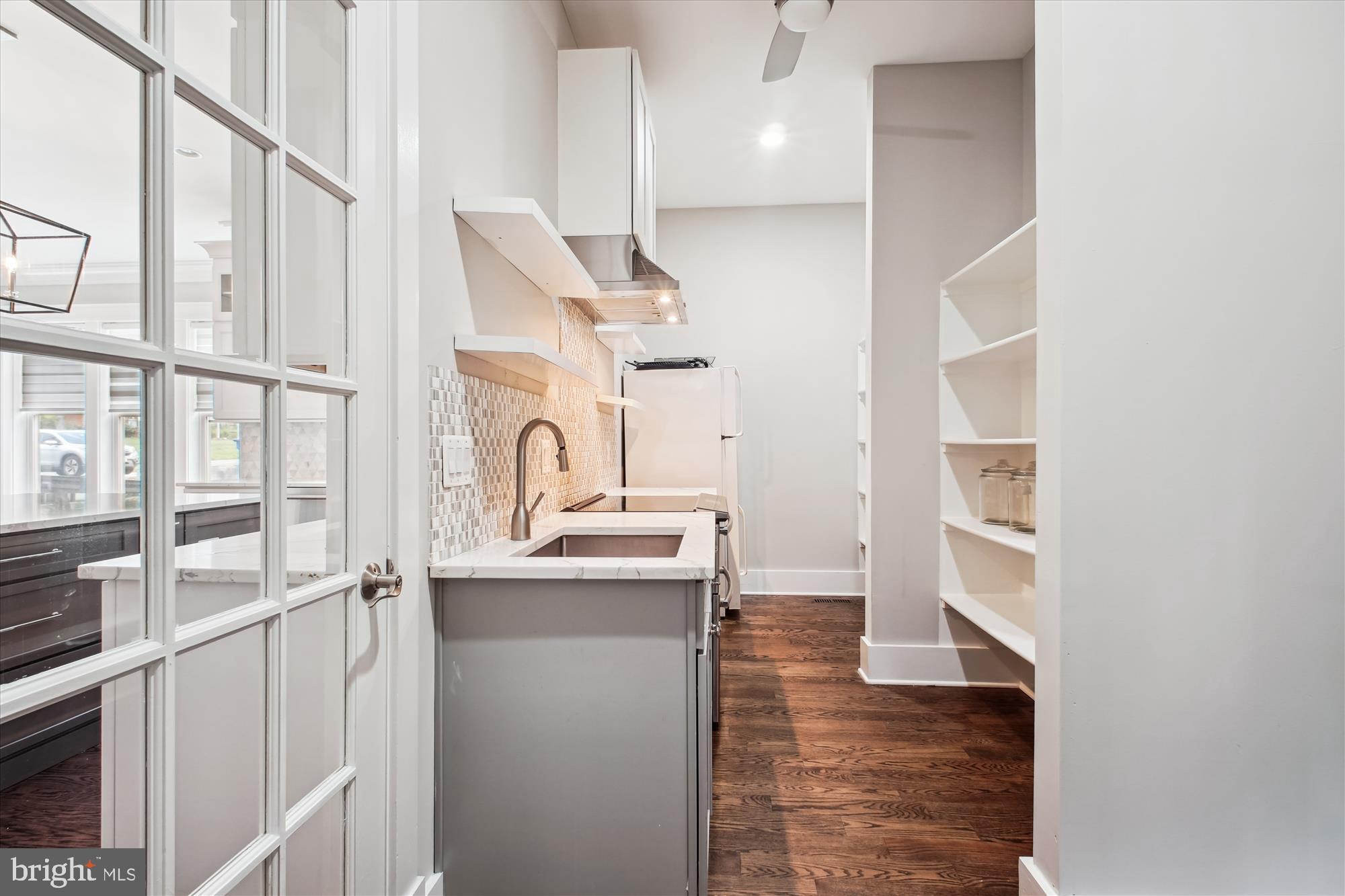 1565 Hane Street McLean, VA 22101 - Photo 34 of 43 a view of a kitchen with a sink and wooden floor