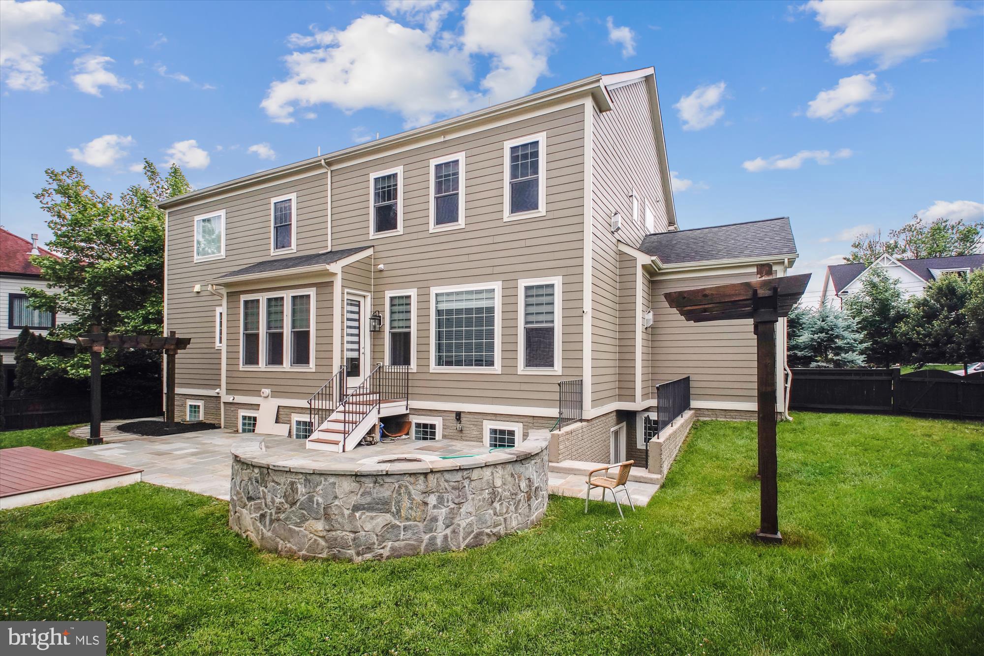 1565 Hane Street McLean, VA 22101 - Photo 39 of 43 a view of a house with a backyard and a patio