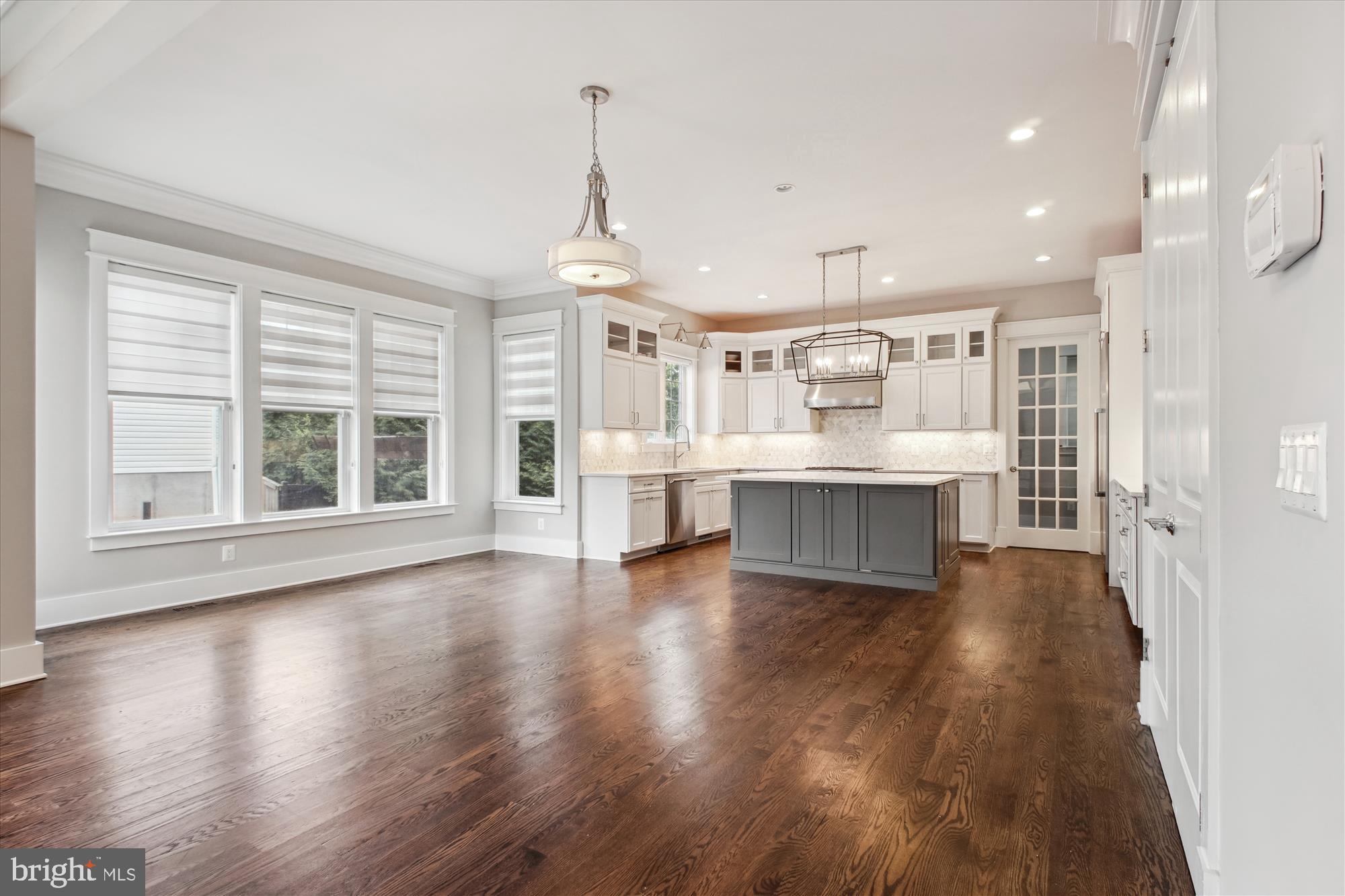 1565 Hane Street McLean, VA 22101 - Photo 6 of 43 a view of big room with wooden floor and windows