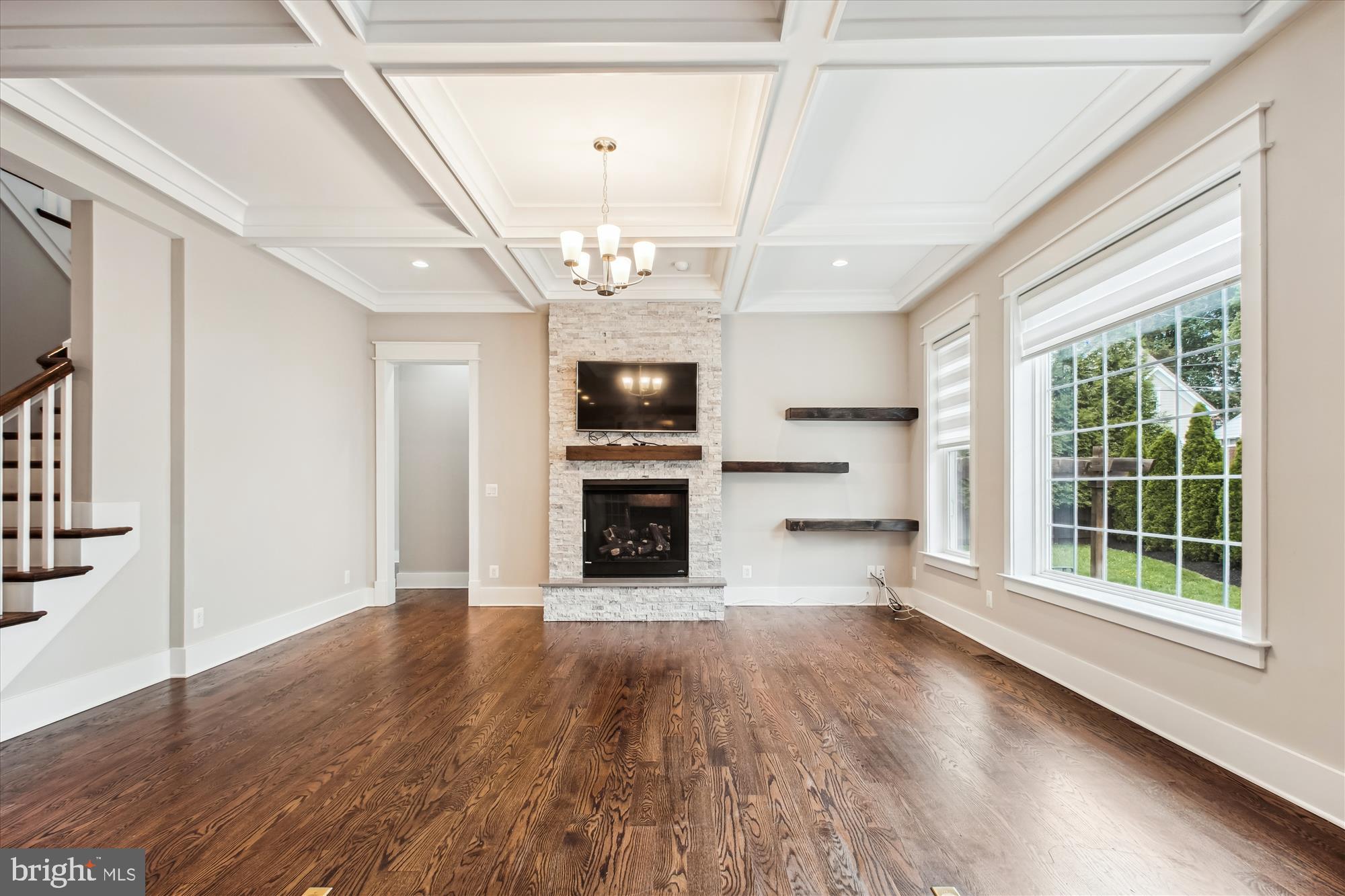 1565 Hane Street McLean, VA 22101 - Photo 9 of 43 a view of a big room with wooden floor fireplace and windows