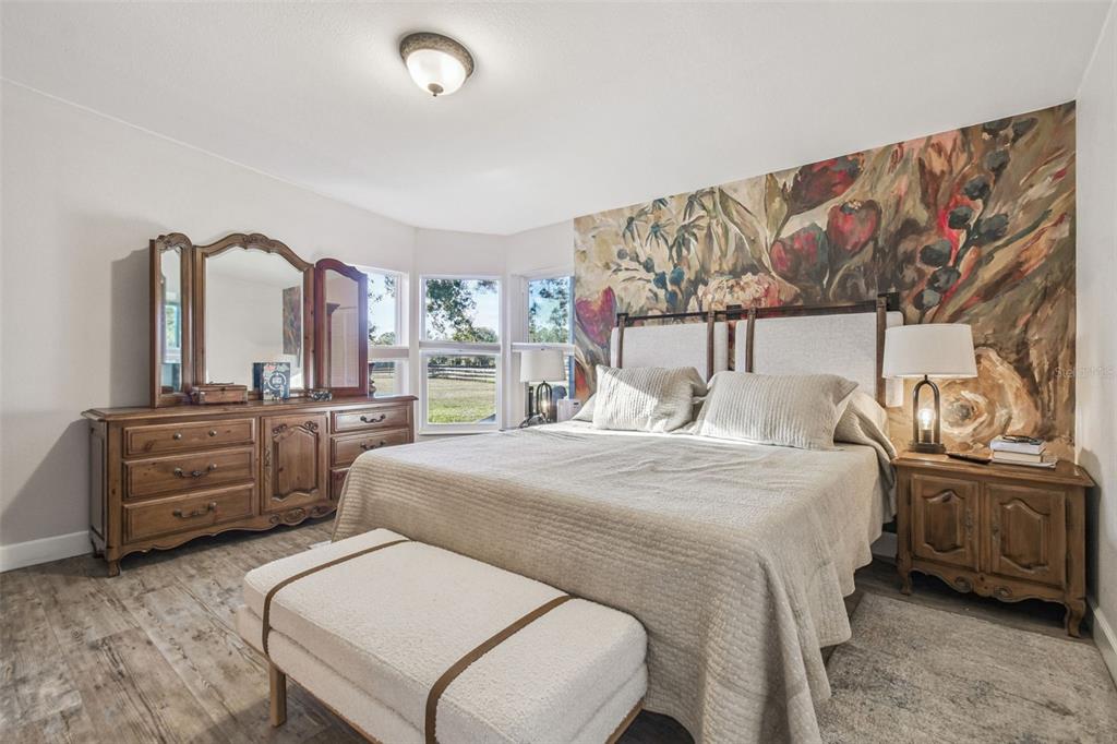 12714 Tyler Run Avenue Odessa, FL 33556 - Photo 17 of 65 a bedroom with a bed and a dresser