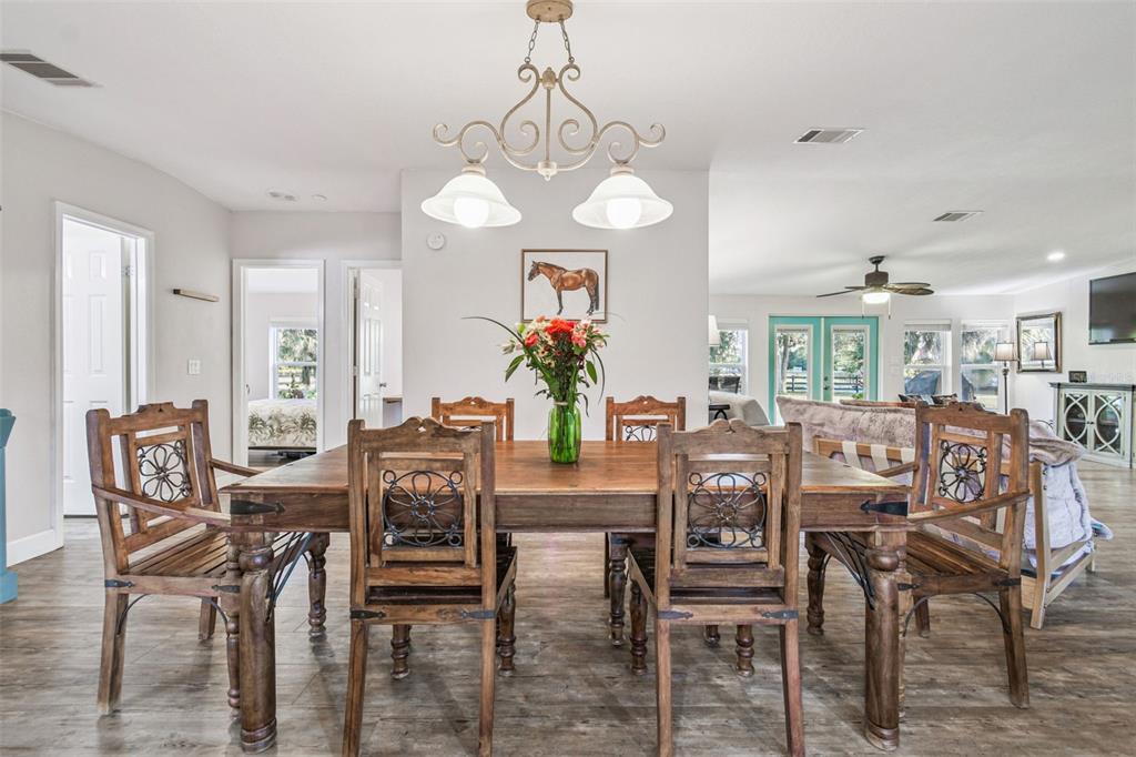 12714 Tyler Run Avenue Odessa, FL 33556 - Photo 33 of 65 a view of a dining room with furniture and wooden floor
