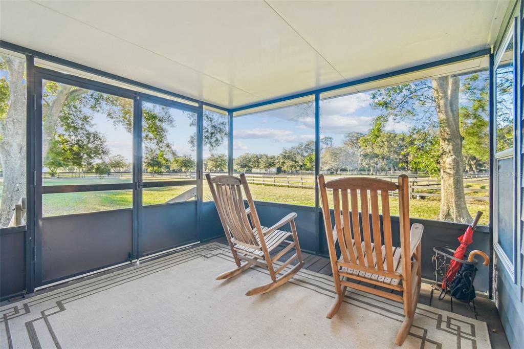 12714 Tyler Run Avenue Odessa, FL 33556 - Photo 38 of 65 a view of a room with a large window and chairs