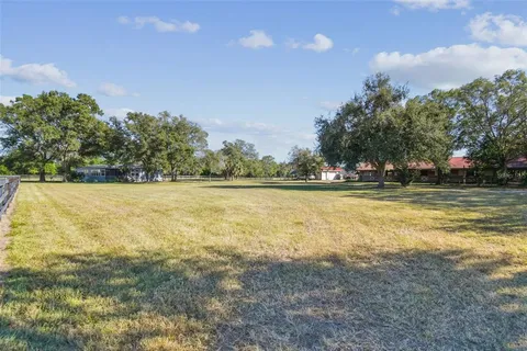 a view of a garden with an outdoor space