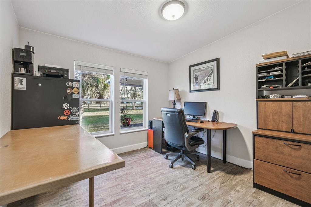 12714 Tyler Run Avenue Odessa, FL 33556 - Photo 50 of 65 a workspace with furniture window and wooden floor