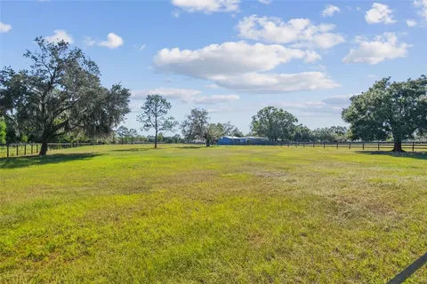 a kitchen with kitchen island a sink appliances and cabinets