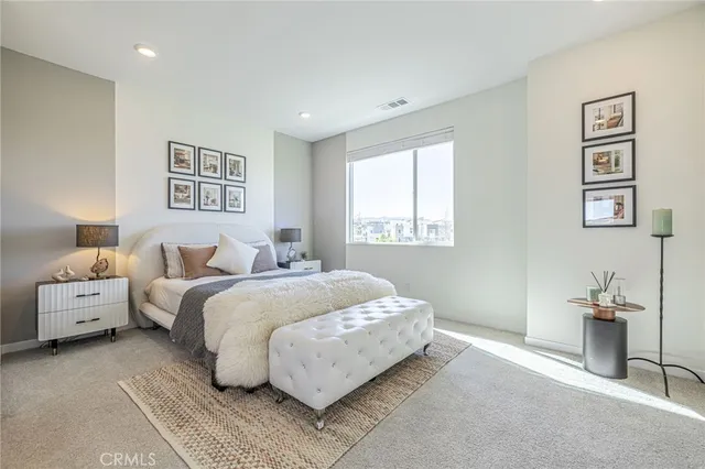 a bathroom with a double vanity sink a mirror and a shower