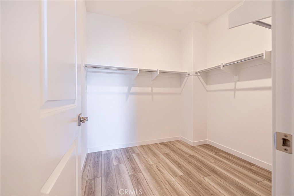 27555 Sanctuary Court Stevenson Ranch, CA 91381 - Photo 19 of 29 a view of a room with wooden floor