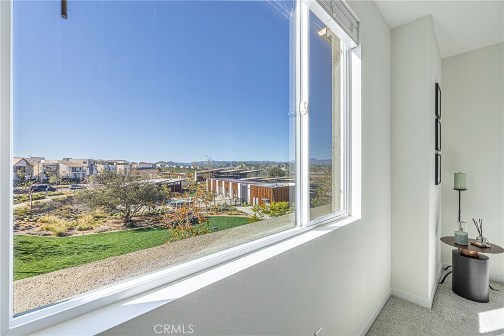 27555 Sanctuary Court Stevenson Ranch, CA 91381 - Photo 20 of 29 a view of a balcony with an outdoor space and seating