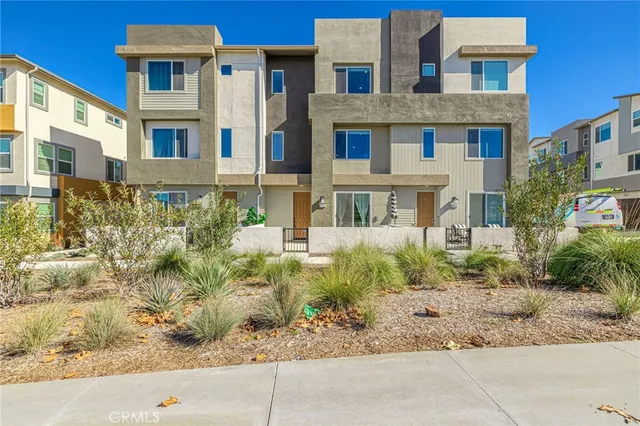 a front view of a multi story residential apartment building