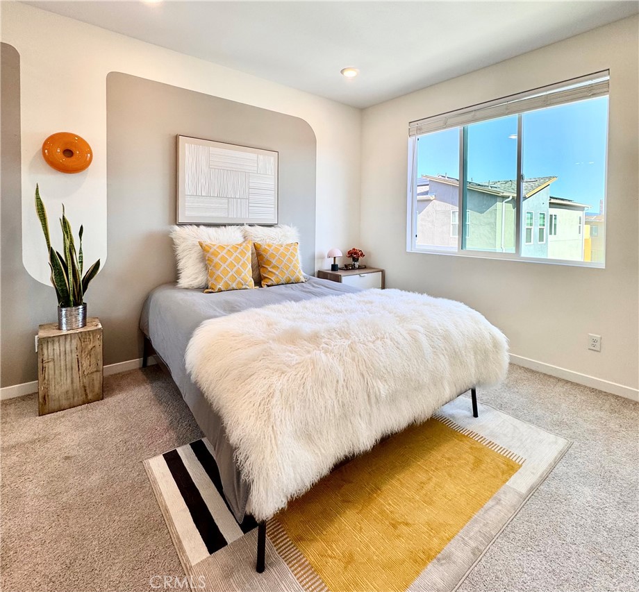 27555 Sanctuary Court Stevenson Ranch, CA 91381 - Photo 21 of 29 a bedroom with bed and a window
