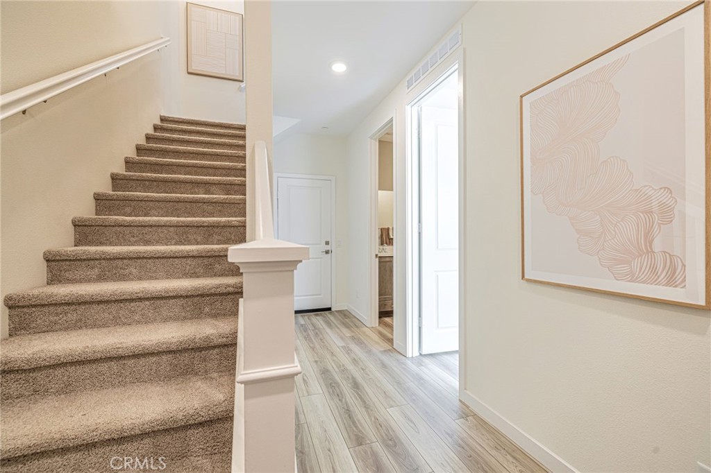 27555 Sanctuary Court Stevenson Ranch, CA 91381 - Photo 23 of 29 a view of entryway with wooden floor and stairs