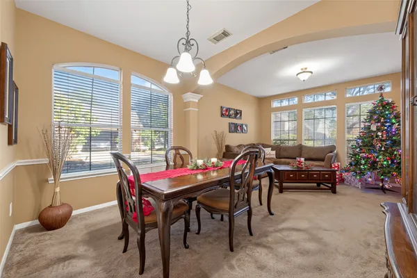 a view of a dining room with furniture window and outside view