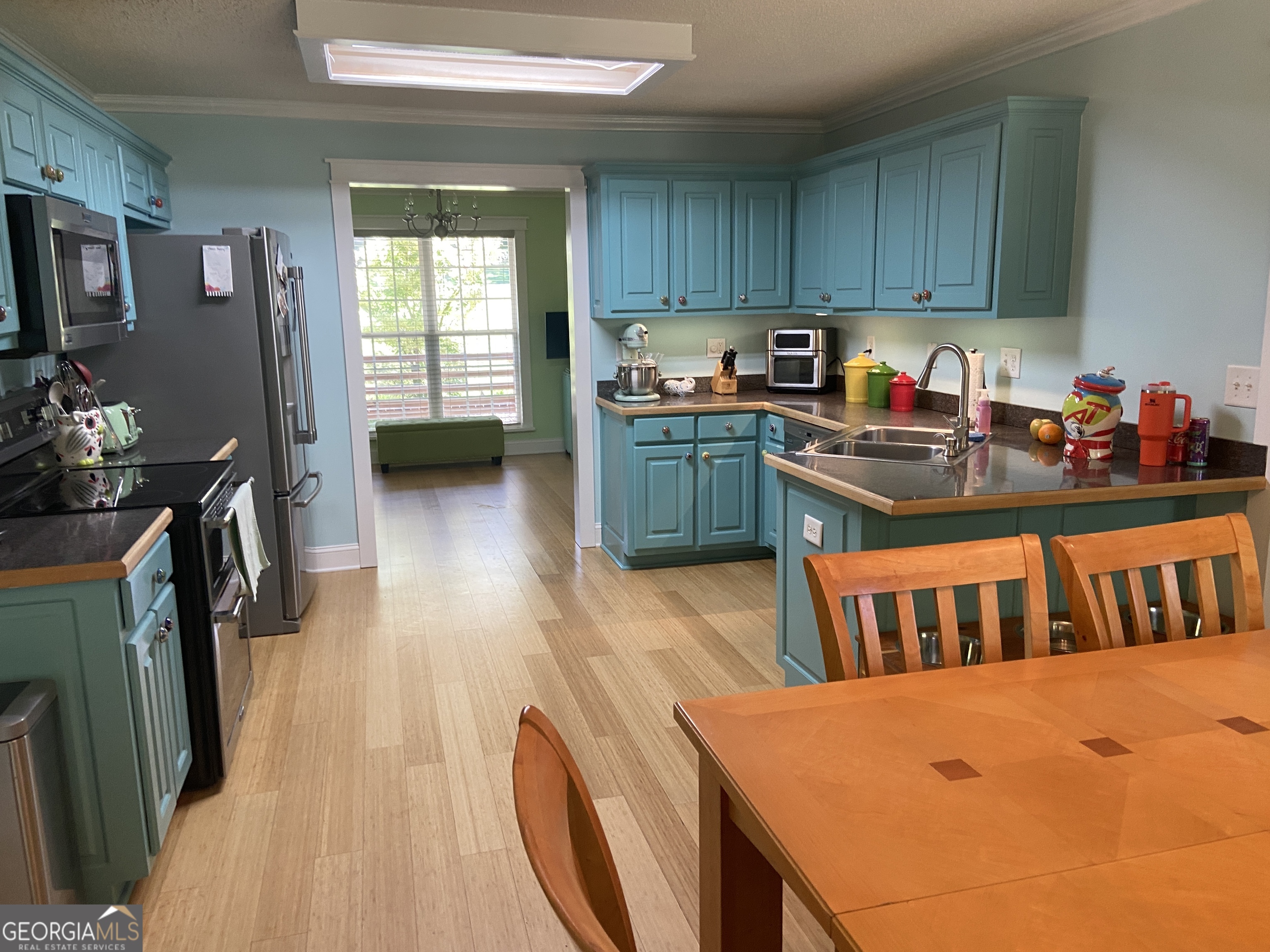 879 Hawk Creek Trail Winder, GA 30680 - Photo 11 of 30 a kitchen that has a sink and a stove in it