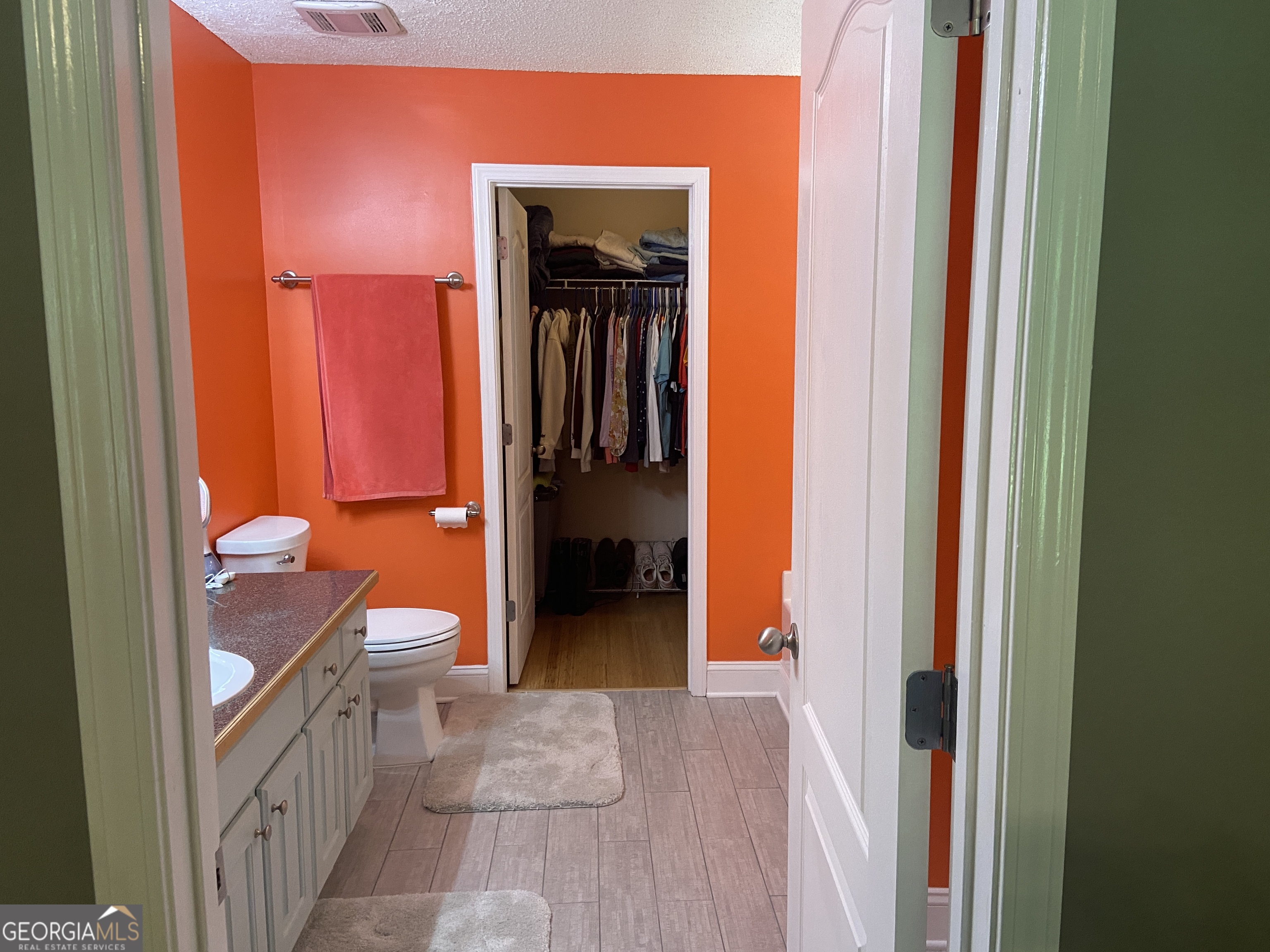 879 Hawk Creek Trail Winder, GA 30680 - Photo 17 of 30 a bathroom with a toilet sink and a shower
