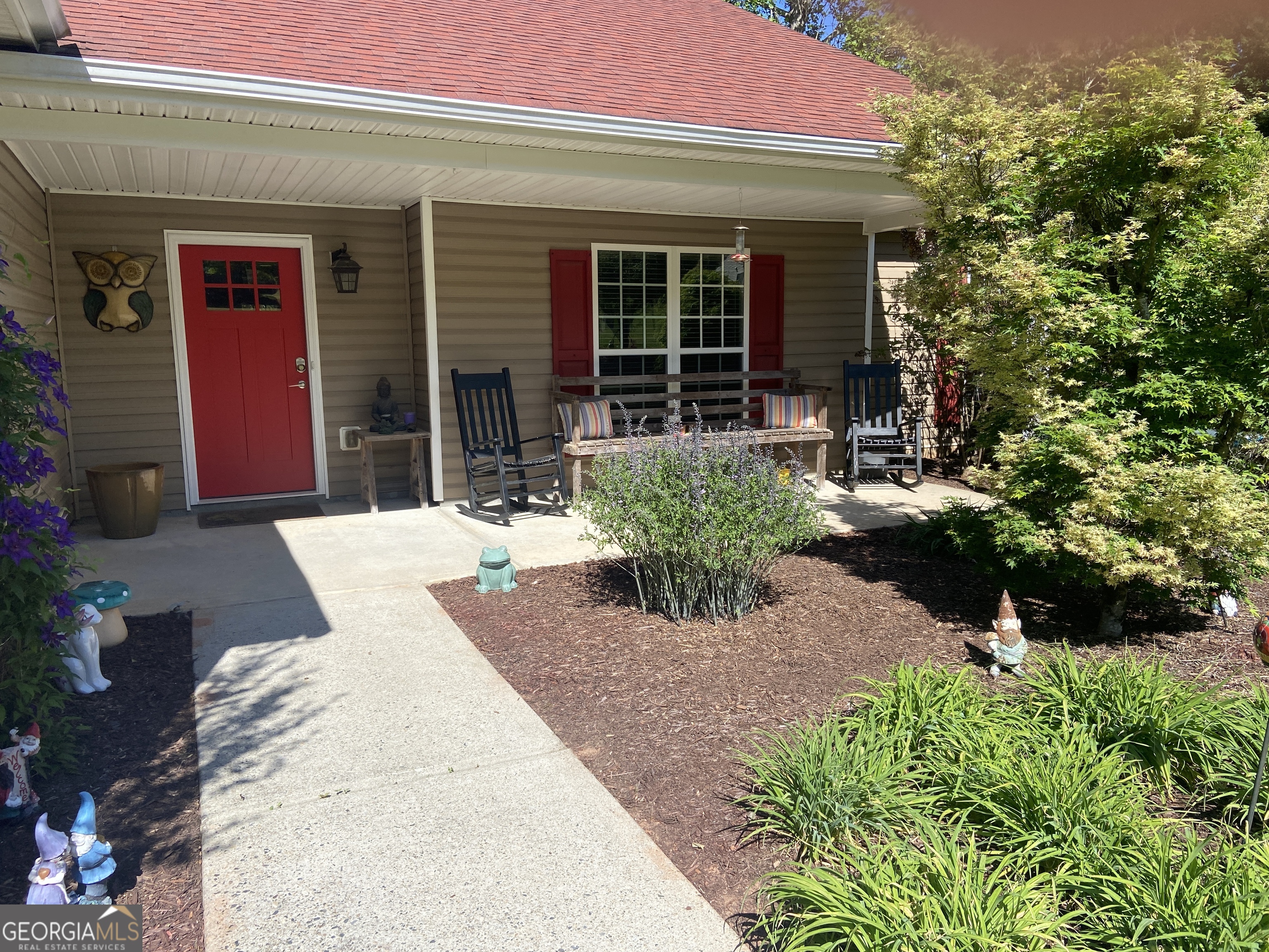 879 Hawk Creek Trail Winder, GA 30680 - Photo 2 of 30 a view of a house with patio
