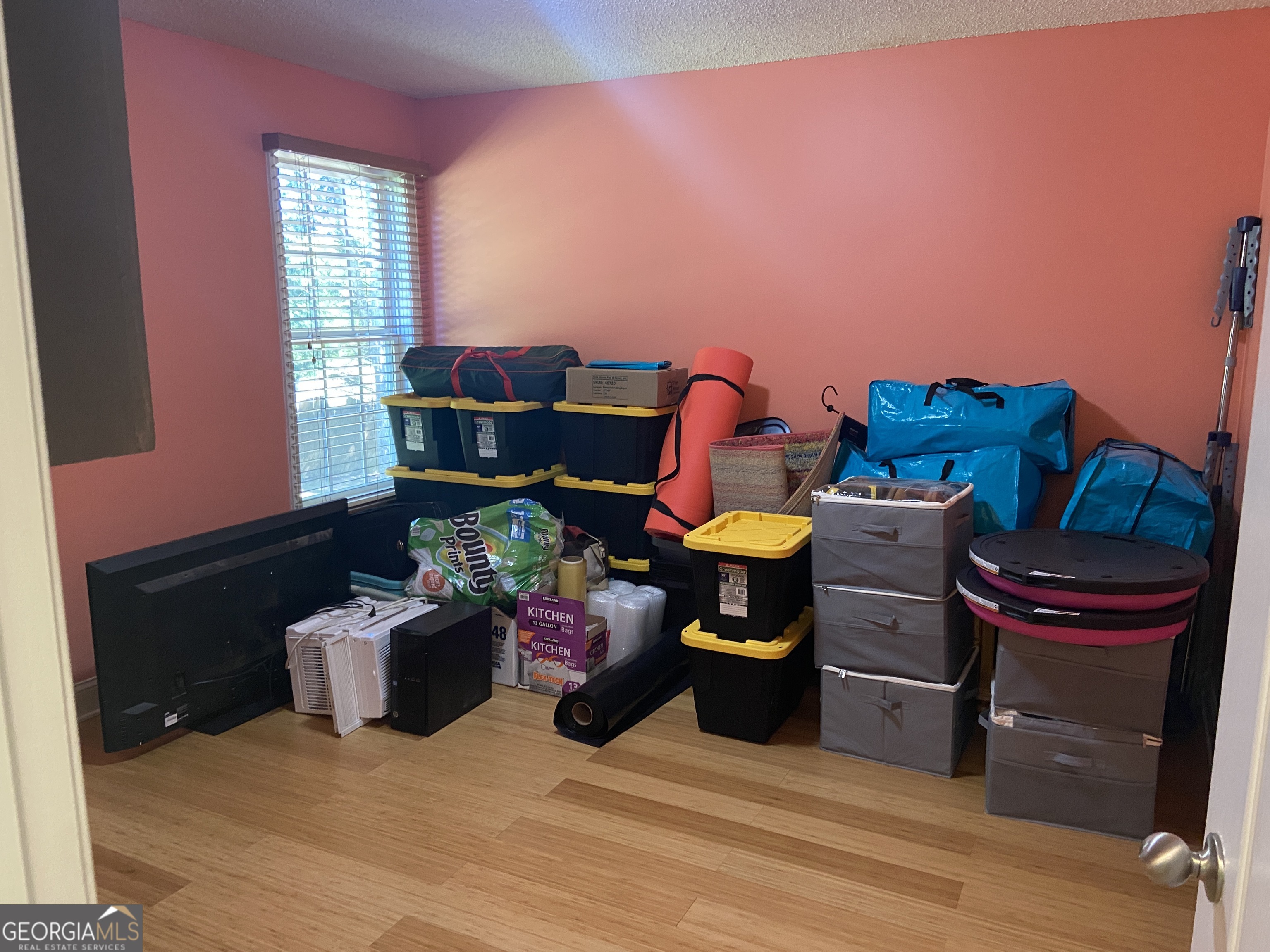 879 Hawk Creek Trail Winder, GA 30680 - Photo 21 of 30 a living room with furniture a rug and a window