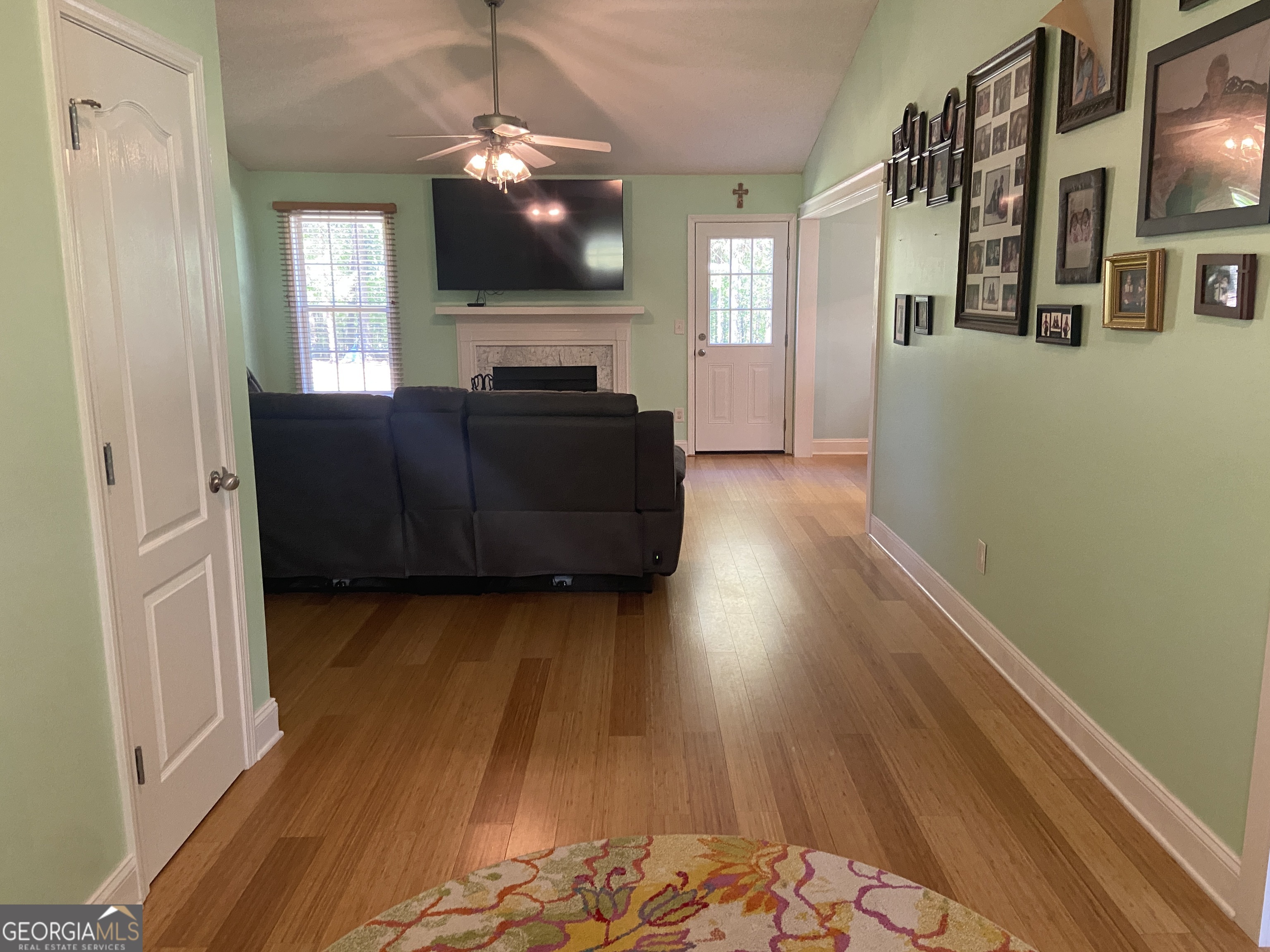 879 Hawk Creek Trail Winder, GA 30680 - Photo 4 of 30 a living room with furniture and a flat screen tv