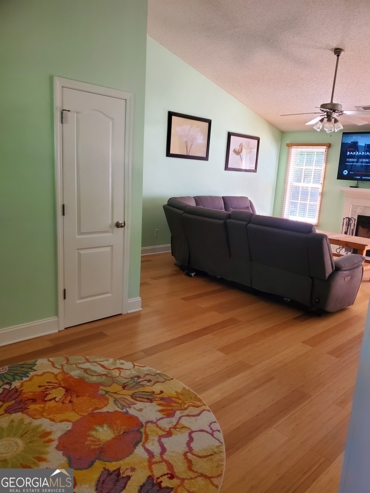 879 Hawk Creek Trail Winder, GA 30680 - Photo 5 of 30 a living room with couch and a window