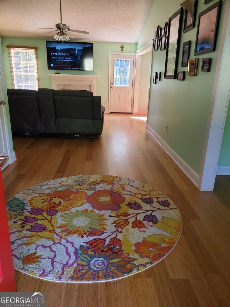 879 Hawk Creek Trail Winder, GA 30680 - Photo 6 of 30 a living room with furniture and a rug