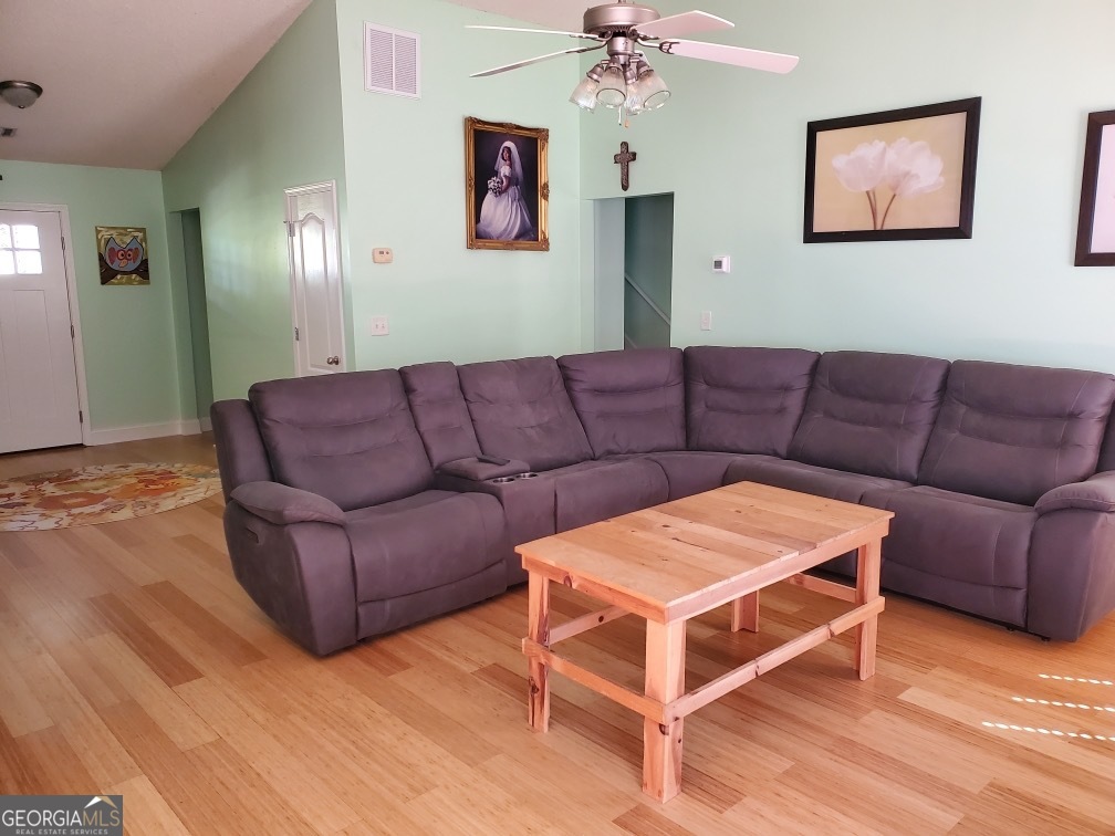 879 Hawk Creek Trail Winder, GA 30680 - Photo 8 of 30 a view of a livingroom with furniture and wooden floor