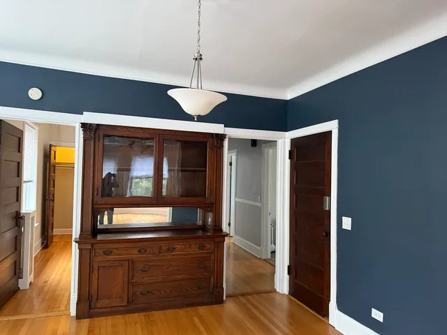 a view of an entryway of dining room and wooden floor