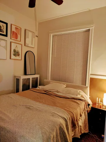 a bedroom with a bed and a closet