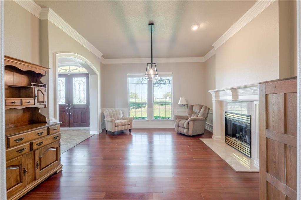 166 East Rio Ridge Azle, TX 76020 - Photo 11 of 40 a living room with furniture fireplace and flat screen tv