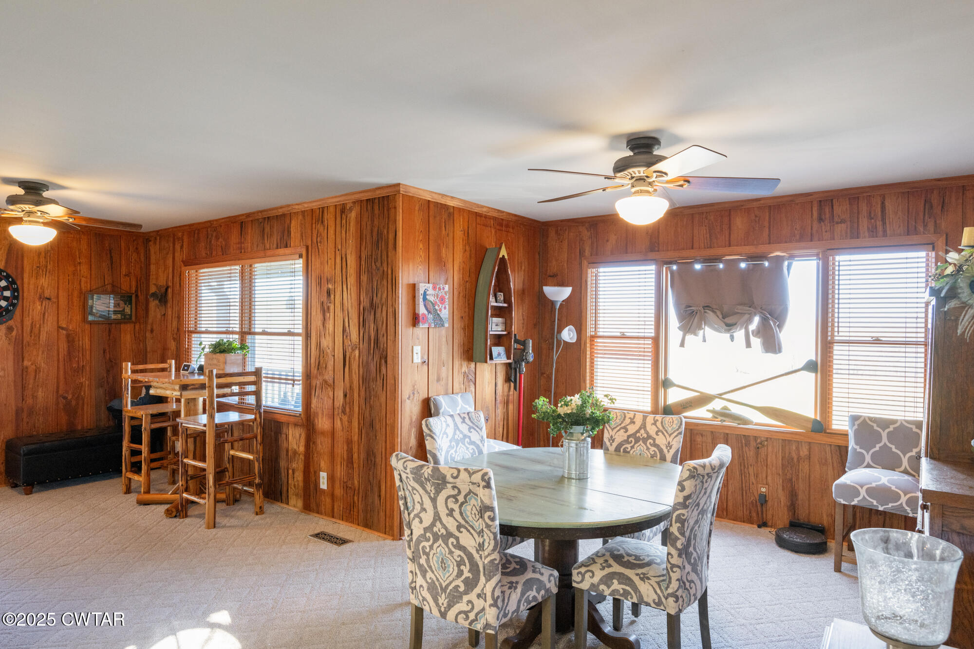 982 Lost Creek Boat Dock Road Decaturville, TN 38329 - Photo 13 of 31 a view of a dining room with furniture window and outside view