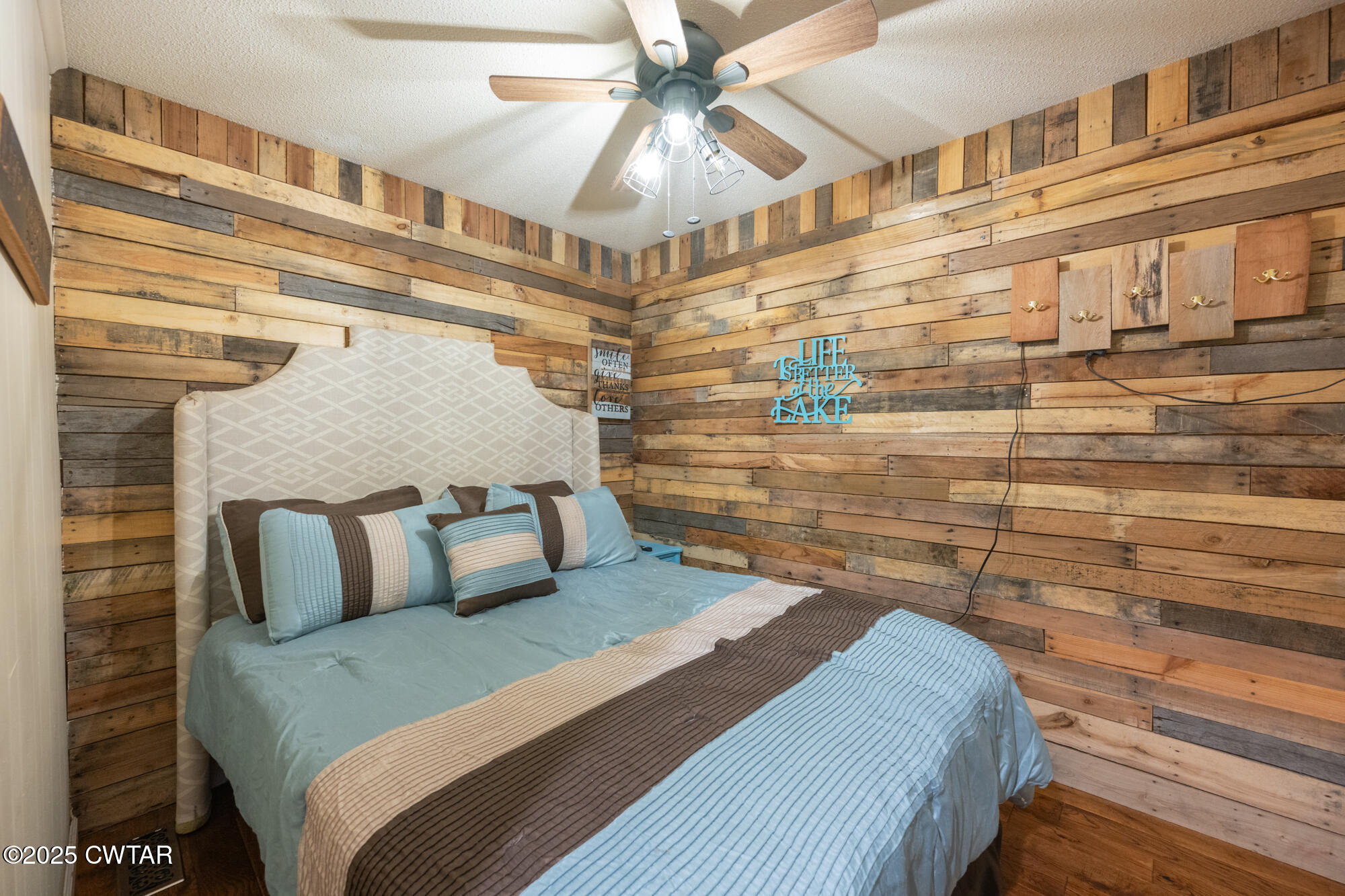 982 Lost Creek Boat Dock Road Decaturville, TN 38329 - Photo 22 of 31 a bedroom with a bed and a walk in closet