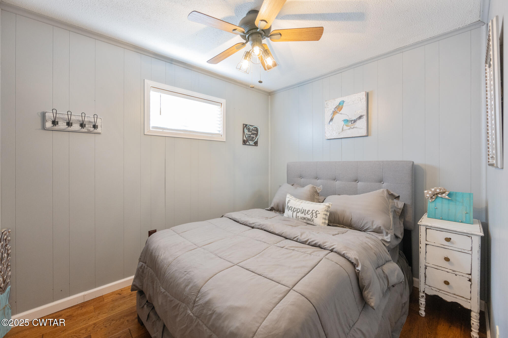 982 Lost Creek Boat Dock Road Decaturville, TN 38329 - Photo 23 of 31 a bedroom with a bed and a window