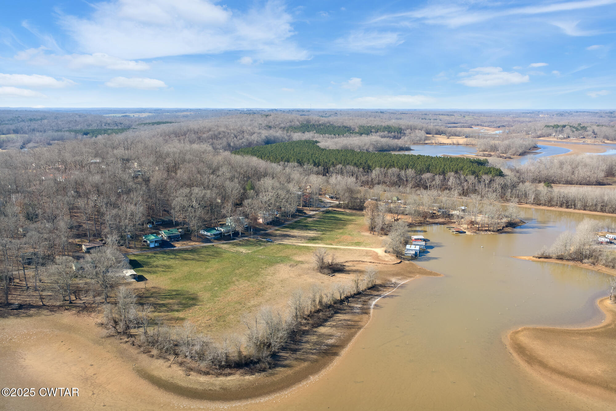 982 Lost Creek Boat Dock Road Decaturville, TN 38329 - Photo 27 of 31 a view of a swimming pool with a yard