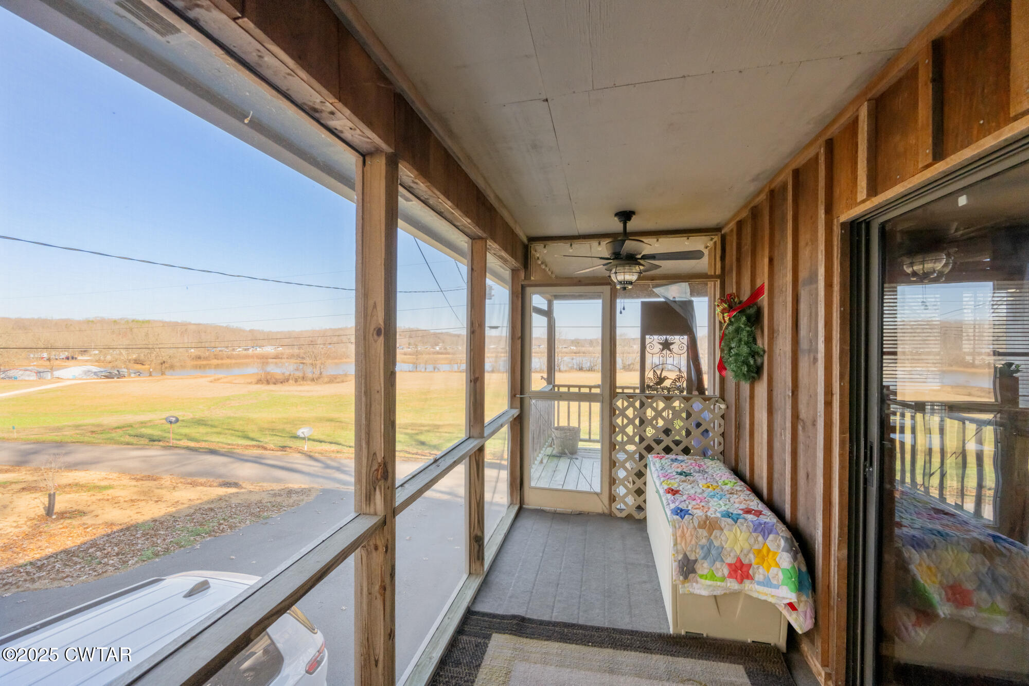 982 Lost Creek Boat Dock Road Decaturville, TN 38329 - Photo 6 of 31 a view of a balcony with wooden floor