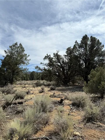 a view of ocean beach and mountain