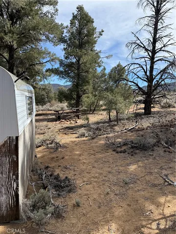 a view of a backyard of the house