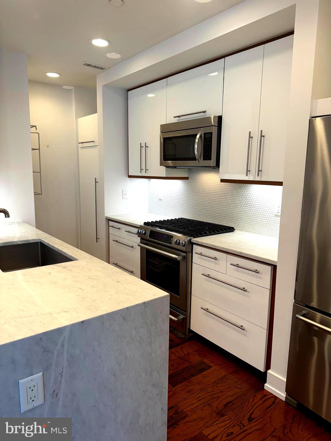 2747 Linden Lane, Unit 104 Silver Spring, MD 20910 - Photo 1 of 29 Carrara marble gourmet kitchen