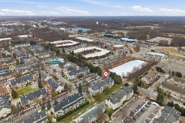 an aerial view of residential building with parking space