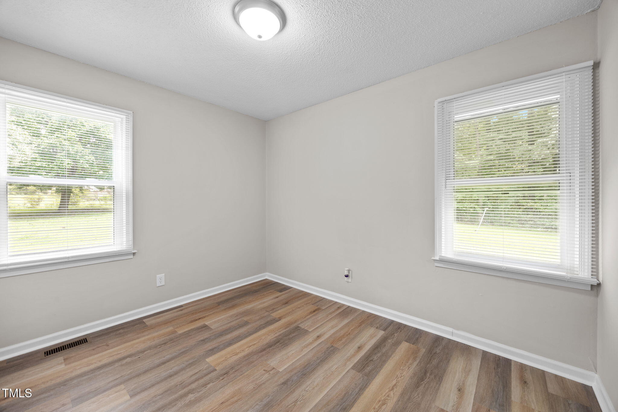 1050 Rock Spring Church Road Henderson, NC 27537 - Photo 12 of 24 an empty room with a window