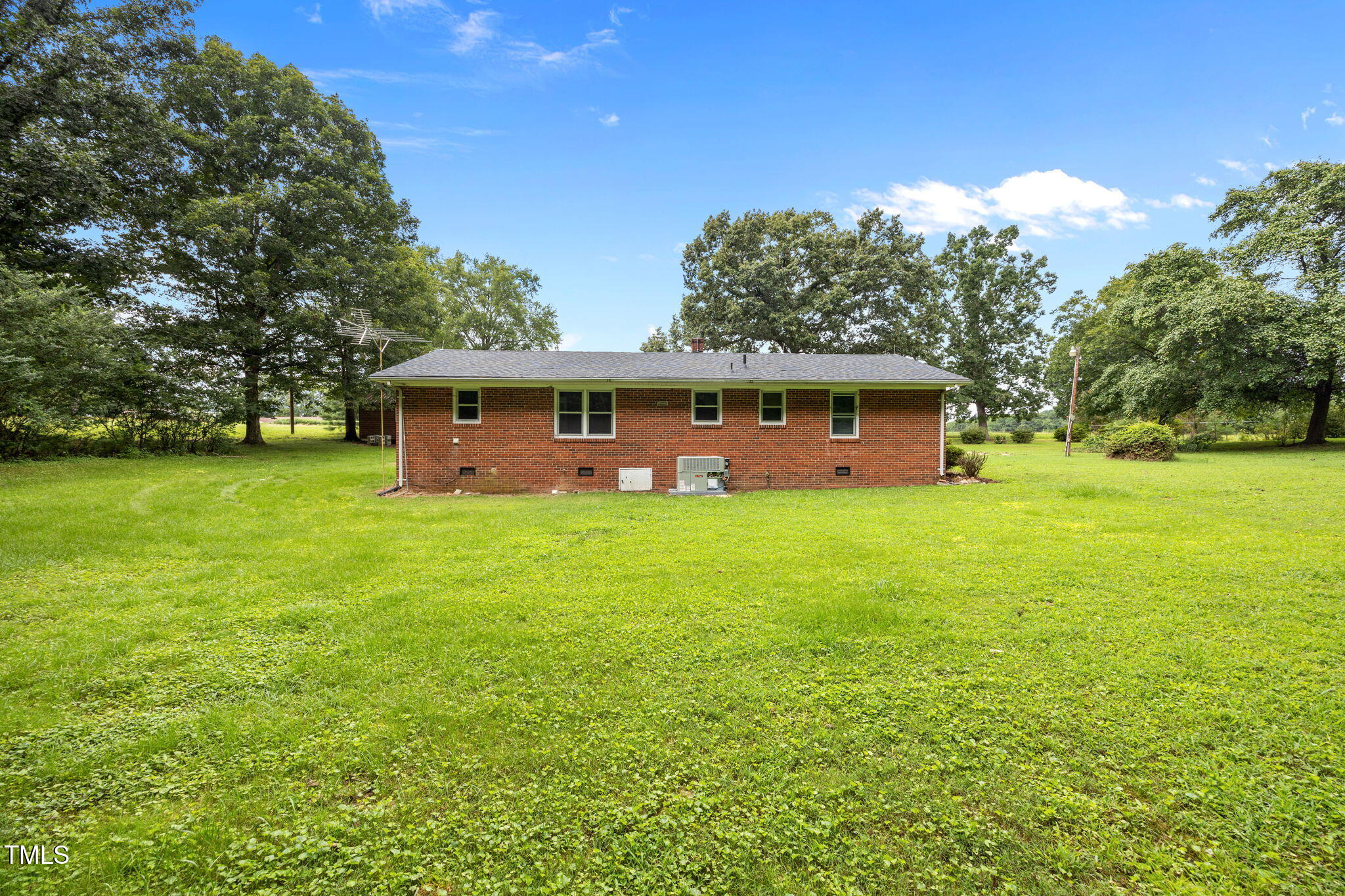 1050 Rock Spring Church Road Henderson, NC 27537 - Photo 14 of 24 a view of a house with a garden