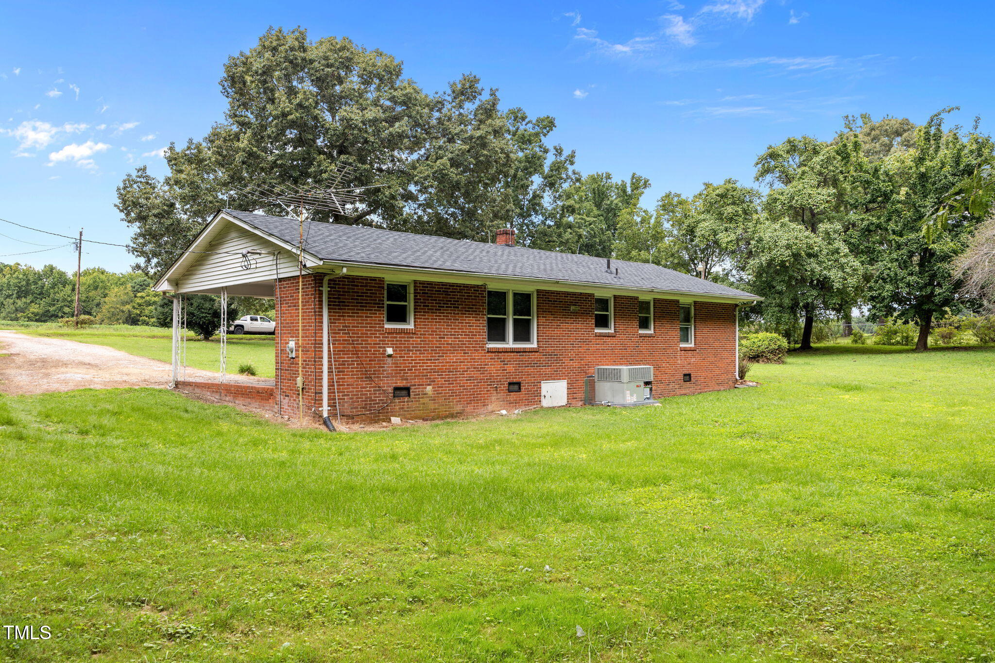 1050 Rock Spring Church Road Henderson, NC 27537 - Photo 16 of 24 a front view of a house with yard and green space